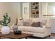 Comfortable living room featuring a sofa, wood floors, and decorative accents at 3804 Nottaway Rd, Durham, NC 27707