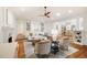 Bright living room features hardwood floors, a ceiling fan, and comfortable seating at 3804 Nottaway Rd, Durham, NC 27707