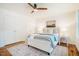 Comfortable main bedroom features hardwood floors, a ceiling fan, and natural light at 3804 Nottaway Rd, Durham, NC 27707