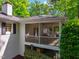 The home features a lovely screened porch and deck with access to the backyard at 3804 Nottaway Rd, Durham, NC 27707