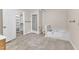 Bathroom showcasing a bathtub, walk-in shower, toilet, and closet at 3909 Inland Ct, Raleigh, NC 27606