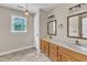 Spacious bathroom with double vanities and ample natural light from the window at 3909 Inland Ct, Raleigh, NC 27606