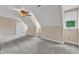Bright bedroom with window, ceiling fan, neutral paint, and neutral carpet at 3909 Inland Ct, Raleigh, NC 27606