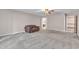 Large bedroom with ceiling fan, neutral walls, and adjoining bathroom at 3909 Inland Ct, Raleigh, NC 27606