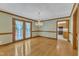 Dining room featuring hardwood floors, chandelier, and glass paneled doors to a covered porch at 3909 Inland Ct, Raleigh, NC 27606