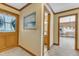 Inviting entryway with wood trim and views into the kitchen and bathroom at 3909 Inland Ct, Raleigh, NC 27606