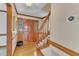 Inviting foyer features hardwood floors, staircase, and a view of the front door at 3909 Inland Ct, Raleigh, NC 27606