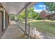Covered front porch with white railings offers views of the expansive front yard at 3909 Inland Ct, Raleigh, NC 27606