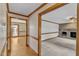 Spacious living room with hardwood floors, neutral walls, and a glimpse of the fireplace at 3909 Inland Ct, Raleigh, NC 27606
