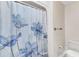 Shower with a blue floral shower curtain and vintage fixtures at 3909 Inland Ct, Raleigh, NC 27606