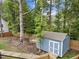 Backyard with a shed, fence, and table with chairs at 408 Jerome Rd, Durham, NC 27713