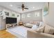 Bright bonus room featuring a large sectional, TV, and soft rug; perfect for relaxing or entertaining at 408 Jerome Rd, Durham, NC 27713