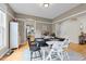 Bright dining room with hardwood floors and neutral paint. Features a modern light fixture and stylish decor at 408 Jerome Rd, Durham, NC 27713