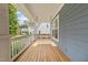 Relaxing front porch with a wooden swing offers a cozy outdoor space with lovely views at 408 Jerome Rd, Durham, NC 27713