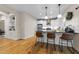 Open kitchen featuring a breakfast bar with seating, white cabinets and an archway at 408 Jerome Rd, Durham, NC 27713