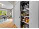 Organized pantry with lots of shelves, storing food and appliances for the kitchen at 408 Jerome Rd, Durham, NC 27713