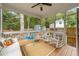 Screened porch with rocking chairs and a view of the backyard at 408 Jerome Rd, Durham, NC 27713