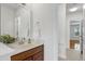 Bathroom with white counters, hardwood floors, a vanity, and views to another room at 419 Travertine Dr, Cary, NC 27519