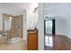 Modern bathroom features a glass-enclosed shower, soaking tub, and vanity with granite countertop at 419 Travertine Dr, Cary, NC 27519