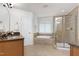 Detailed bathroom featuring a granite counter vanity, bathtub and glass enclosed shower at 419 Travertine Dr, Cary, NC 27519