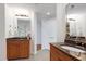 Bright bathroom featuring granite countertops, double sinks, and neutral tile flooring at 419 Travertine Dr, Cary, NC 27519