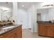 Spacious bathroom featuring double vanities with granite countertops and tile flooring at 419 Travertine Dr, Cary, NC 27519