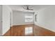 A light-filled bedroom features hardwood floors and multiple windows at 419 Travertine Dr, Cary, NC 27519