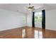 Inviting bedroom with vaulted ceiling, hardwood floors, and plenty of natural light from the windows at 419 Travertine Dr, Cary, NC 27519
