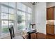 Bright breakfast nook with large windows and table, adjacent to kitchen and cabinetry at 419 Travertine Dr, Cary, NC 27519