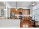 Beautiful kitchen with custom wood cabinets, stainless appliances, granite countertops and recessed lighting at 419 Travertine Dr, Cary, NC 27519