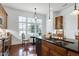 Open Kitchen with stainless appliances, granite counters, custom cabinetry, and breakfast nook at 419 Travertine Dr, Cary, NC 27519