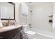 Cozy bathroom featuring a shower-tub combination with white subway tile surround and granite vanity at 4704 Lancashire Dr, Raleigh, NC 27613