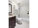 Cozy bathroom featuring a shower-tub combination with white subway tile surround and granite vanity at 4704 Lancashire Dr, Raleigh, NC 27613