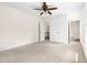 Bedroom featuring neutral carpet, a ceiling fan, and natural light at 4704 Lancashire Dr, Raleigh, NC 27613