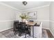 Cozy dining room with wood table, black chairs, and stylish decor at 4704 Lancashire Dr, Raleigh, NC 27613