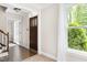 Bright foyer with hardwood floors and decorative front door at 4704 Lancashire Dr, Raleigh, NC 27613