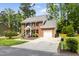 Attractive brick home featuring an attached garage, and a large driveway at 4704 Lancashire Dr, Raleigh, NC 27613