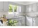 Well-lit kitchen with stainless steel appliances and white tile backsplash at 4704 Lancashire Dr, Raleigh, NC 27613