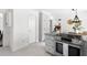 Bright kitchen with stainless steel appliances, granite countertops, and white cabinetry at 4704 Lancashire Dr, Raleigh, NC 27613