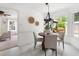 Breakfast nook with a wooden table with access to kitchen and outdoor living space at 4704 Lancashire Dr, Raleigh, NC 27613