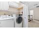 Convenient laundry room featuring side by side washer and dryer on the second level at 4704 Lancashire Dr, Raleigh, NC 27613