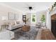 Spacious living room with neutral décor, fireplace, and plenty of natural light at 4704 Lancashire Dr, Raleigh, NC 27613