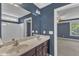 Bathroom featuring double sinks with counter space and a door leading to the bedroom at 4727 Smarty Jones Dr, Knightdale, NC 27545