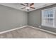Bedroom featuring carpet, a ceiling fan, and natural light from the window at 4727 Smarty Jones Dr, Knightdale, NC 27545