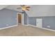 Neutral bedroom featuring a ceiling fan, gray walls and an attic access door at 4727 Smarty Jones Dr, Knightdale, NC 27545