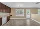 Bright kitchen with stainless steel appliances, dark cabinets, and adjacent breakfast area at 4727 Smarty Jones Dr, Knightdale, NC 27545