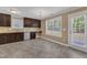 Kitchen features dark cabinets, modern appliances, tiled backsplash, and lots of natural light at 4727 Smarty Jones Dr, Knightdale, NC 27545