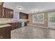 View of the updated kitchen featuring dark cabinets, stainless appliances, and lots of natural light at 4727 Smarty Jones Dr, Knightdale, NC 27545
