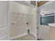 A compact laundry room with tiled floors, hanging rack and necessary hookups at 4727 Smarty Jones Dr, Knightdale, NC 27545