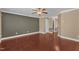 View of a large living room showcasing hardwood floors, crown molding and a modern color scheme at 4727 Smarty Jones Dr, Knightdale, NC 27545